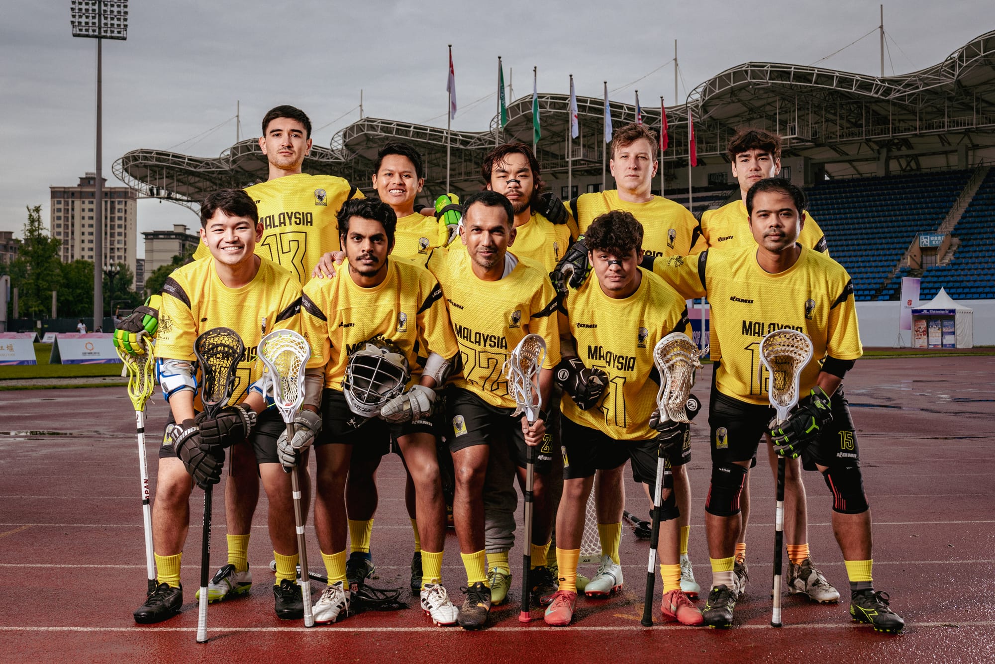 Group photo of Malaysian lacrosse team. 2 rows of 10 players.